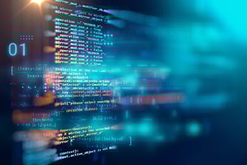 Code showed on computer screen with bright flashes of light